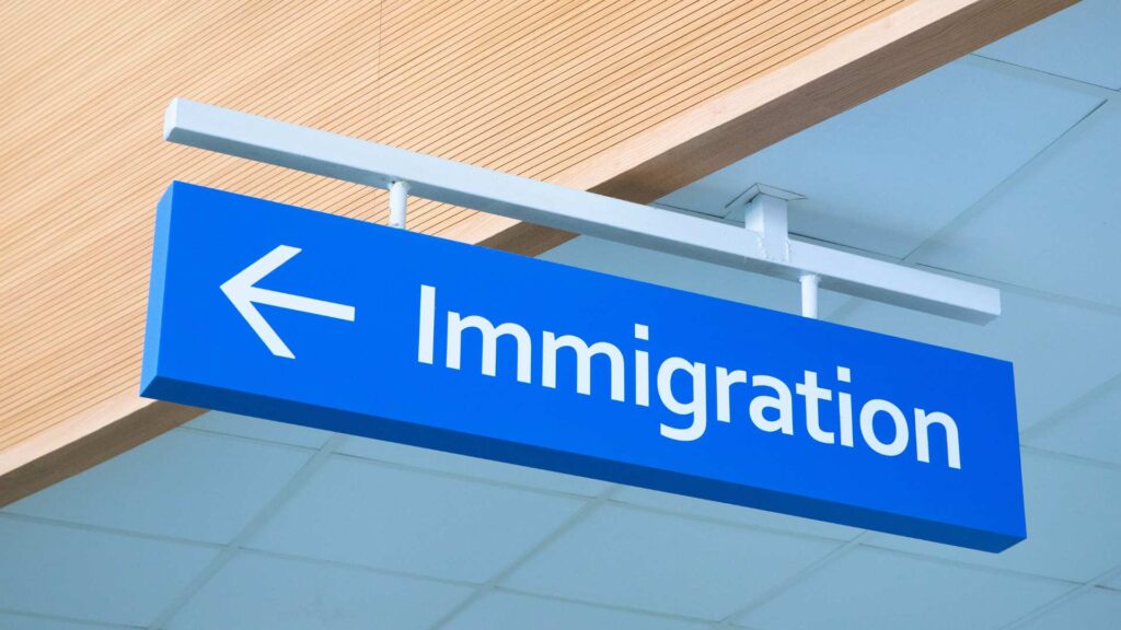 a blue immigration sign